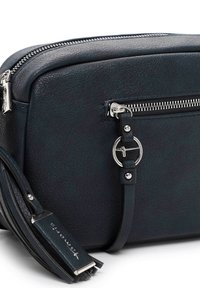 Schwarze, strukturiert Leder-Crossbody-Tasche mit silbernem Reißverschluss und rundem Metallring-Detail an der Fronttasche sowie Lederquaste am Riemen.