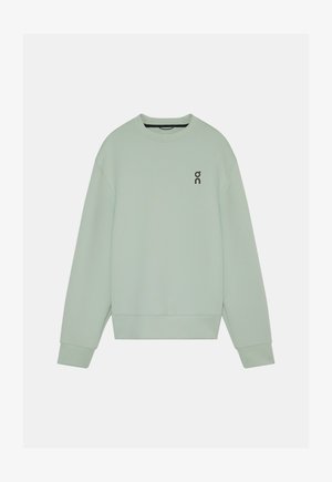 Felpa verde chiaro a maniche lunghe con scollo rotondo, polsini e orlo a coste, e un piccolo logo nero "on" sul petto a sinistra.