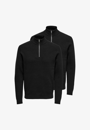Two black zippered sweaters with a high collar, featuring a ribbed texture and long sleeves, displayed side by side.