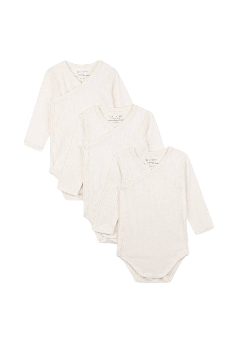 Trois bodies à manches longues pour bébé en crème, fabriqués en tissu côtelé, avec une fermeture au niveau du col et une texture douce pour le confort.