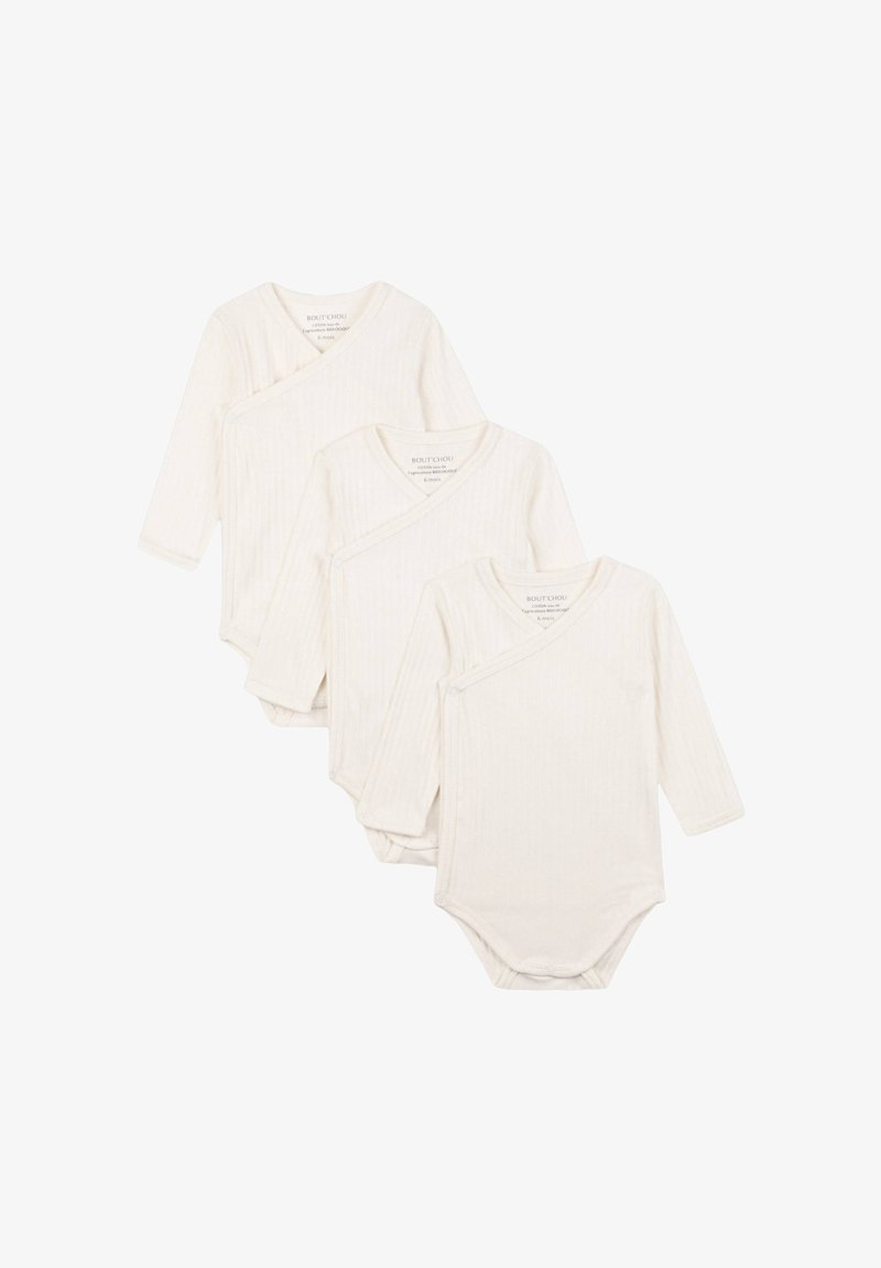 Trois bodies à manches longues pour bébé en crème, fabriqués en tissu côtelé, avec une fermeture au niveau du col et une texture douce pour le confort.
