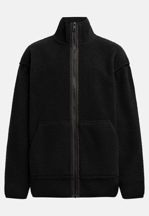 Veste en polaire noire avec col montant, fermeture éclair sur toute la longueur à l'avant et deux poches latérales. Tissu texturé avec une fermeture éclair et des poignets lisses.