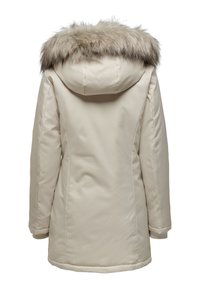 Manteau d'hiver beige avec une capuche, orné d'une épaisse bordure en fourrure brun-gris, vu de l'arrière sur fond blanc.