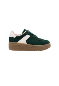 Green suede sneakers feature a white leather accent, round toe, and a thick brown rubber sole with textured lines. Laces match the shoe color.