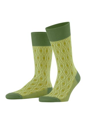 Green patterned socks featuring a textured, light green body with a darker green ribbed cuff and toe. The design includes a diamond motif.