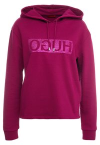 Sweat à capuche fuchsia à manches longues, capuche avec cordon de serrage et logo pailleté. Matière douce ; coupe décontractée ; poignets et ourlet côtelés.