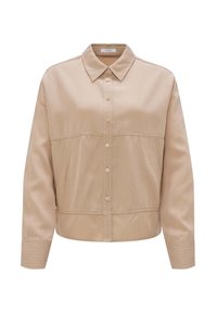 Veste beige boutonnée avec col, manches longues, détails de coutures horizontales et diagonales, et larges poignets.