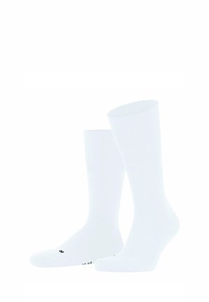 Weiße Baumwollsocken mit geripptem Design, in knöchelhöhe und dezentem schwarzen Branding auf den Zehen. Weiches und leichtes Material.