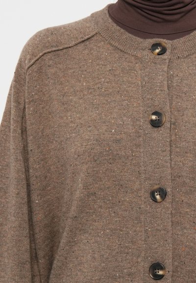 Brown cardigan made of textured knit fabric with multicolored flecks. Features a round neckline and four round buttons down the front.