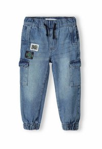 Denim cargo pants in light blue, featuring an elastic waistband, drawstring, side pockets, and decorative patches on the front.