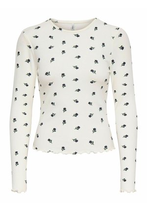 Langsleeve ribbed top in off-white met verspreide marineblauwe bloemenprint. Heeft een geschulpte zoom en zachte, gestructureerde stof.