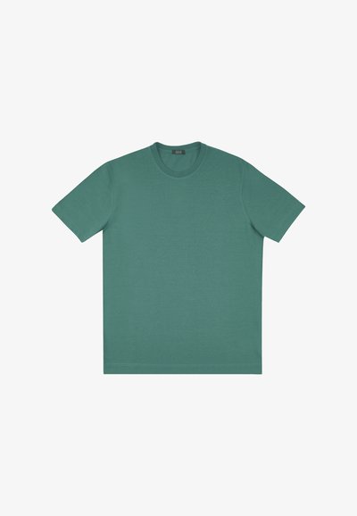 T-shirt en coton vert avec un encolure arrondie, des manches courtes et une coupe droite. Texture lisse, sans motifs ni accents.