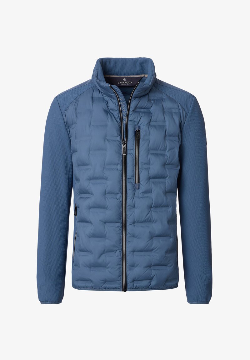 Blå polstret jakke med en quiltet front, glatte ærmer, høj krave og lynlåslommer. Har et hybriddesign med teksturerede accenter.