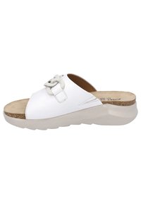 White slide sandal features a soft leather upper, adjustable strap, and cushioned insole with a textured outsole for grip.