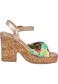 Korkkiloggvän med en färgglad, mönstrad textilövre. Har en metallisk vristrem och en rund tådesign.