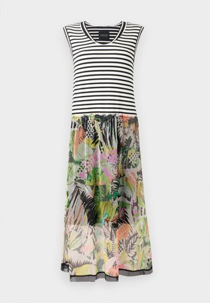 Raidallinen hihaton mekko, jossa on musta-valkoinen yläosa ja värikäs, kuvioitu kukkimekko, jossa on vihreitä, vaaleanpunaisia ja mustia vivahteita.