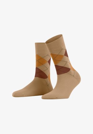 Beige cotton socks with a diamond pattern in orange, brown, and yellow, featuring dark green accents along the diamond edges.