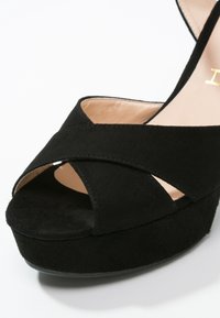 Unisa Sandaletter - black