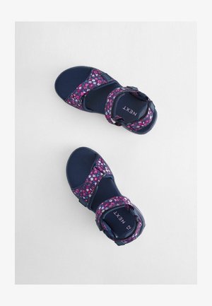 Mornarske sandale s remenima s cvjetnim uzorkom, čičak zatvaranjem i obućom s udobnim potplatima. Lagani dizajn prikladan za svakodnevno nošenje.