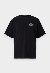 T-shirt in cotone nero con maniche corte. Il frontale presenta testo bianco e design grafici, inclusi caratteri giapponesi e nome del marchio.