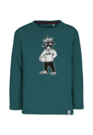 Teal pitkähihainen paita, jossa on graafinen kuva kruunusta olevasta hahmosta hupparissa, joka pitää koriottopalloa ja jossa on teksti "G.O.A.T.".