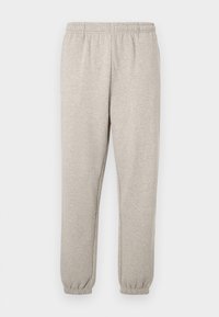 Γκρι φόρμα με ελαστική μέση, μανσέτες στους αστραγάλους και απαλή υφή. Απλός σχεδιασμός χωρίς εμφανή μοτίβα ή διακοσμητικά στοιχεία.