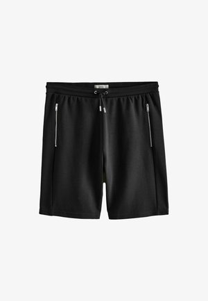 Schwarze Freizeithose mit Kordelzug an der Taille und zwei vertikalen Reißverschlusstaschen vorne.