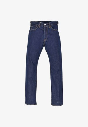 Tume sinine denimist teksapüksid sirge lõikega, viie taskuga ja kontrastsete õmblustega. Omab nupu suletust ja metallsüste.