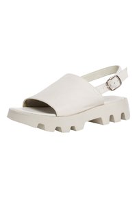 Beige leather sandal with an open toe, adjustable heel strap, and a chunky, textured sole featuring deep grooves for grip.