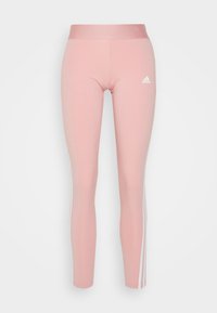 Ljust rosa leggings med hög midja, med vita sidostråk och Adidas-logotyp i vitt på övre vänstra sidan fram.