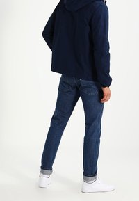 Tommy Jeans Tunn jacka - dark blue