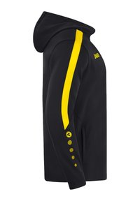 Svart huvtröja med gula meshdetaljer på ärmar och muddar. Har fem cirkulära gula knappar och "JAKO"-logotypen vid axeln.