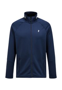 Marineblauwe vest met rits en hoge kraag, gemaakt van gladde stof. Voorzien van zijzakken en een klein logo op de borst en kraag.