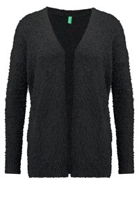 Cardigan nero con maniche lunghe, design a V, e tessuto testurizzato e peloso. Apertura frontale senza bottoni o chiusure.