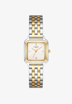 Kvadrātveida sudraba un zelta pulkstenis ar baltu ciparnīcu, zelta rādītājiem un nerūsējošā tērauda siksniņu, kurai ir maiņus sudraba un zelta posmi.