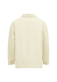 Lys gul, jakke med lange ærmer, krave og elastiske manchetter. Fremstillet af glat materiale med et minimalistisk design, ingen synlige lukninger.
