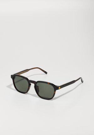 Tortoiseshell sunglasses with a square frame, green lenses, and thin temples. Features a small square accent on the side.