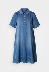 Rövid ujjú, galléros, gombos farmerruha. Oldalzsebekkel és kontrasztos varrással rendelkezik. Színe világoskék.