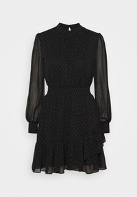 Vestido negro con mangas largas y transparentes, cuello alto, cintura fruncida y dobladillo con volantes. Presenta pequeños puntos rosas en toda la tela.