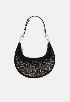 Black crescent-shaped handbag with black and silver rhinestones, gold-tone hardware, and adjustable shoulder strap with Guess logo badge.