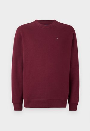 Bordeaux crew neck sweatshirts med lange ærmer og lille rektangulært logo på øverste venstre bryst mod en plain hvid baggrund.