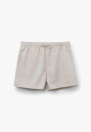 Pantalones cortos informales beige claro con cinturilla elástica y cordón frontal, con bolsillos laterales, colocados planos sobre fondo blanco.