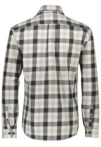 Chemise à manches longues à motif à carreaux noir et blanc, vue de dos, avec poignets boutonnés et col droit.