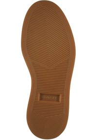 Gummisohle in Tan mit einem strukturierten, Zickzackmuster, das ein zentrales Rechteck aufweist, das mit "GANT" und der Größe "42" geprägt ist.