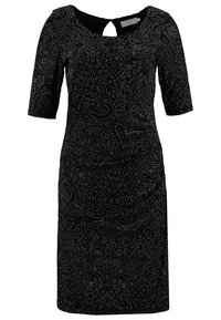 Robe noire jusqu'aux genoux avec manches courtes, col rond avec ouverture en forme de goutte, et motifs tourbillonnants complexes en points argentés.