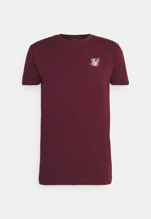 T-shirt à manches courtes bordeaux avec col rond et petit logo blanc brodé sur la poitrine gauche.