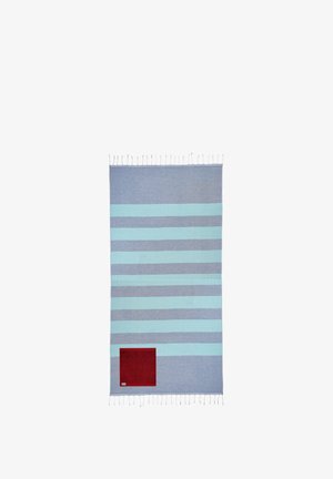 Cotton towel featuring alternating light blue and grey stripes, with a red textured square detail at the bottom and fringed edges.