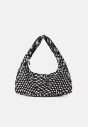 Black bag with a curved, hobo shape, textured fabric featuring silver studs. Singular top handle, zip closure, and soft silhouette.
