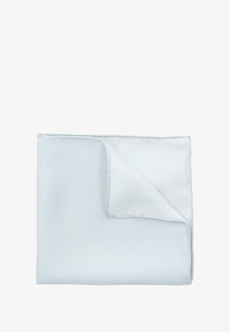 Jasnoniebieski złożony serwetka z delikatnie podniesionym rogiem, ukazująca gładką strukturę materiału.
