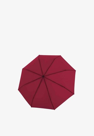 Parapluie rouge ouvert vu de dessus, montrant huit panneaux renforcés avec des baleines noires et une pointe centrale.